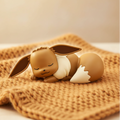 Eevee Oyasumi figure on cosy caramel blanket